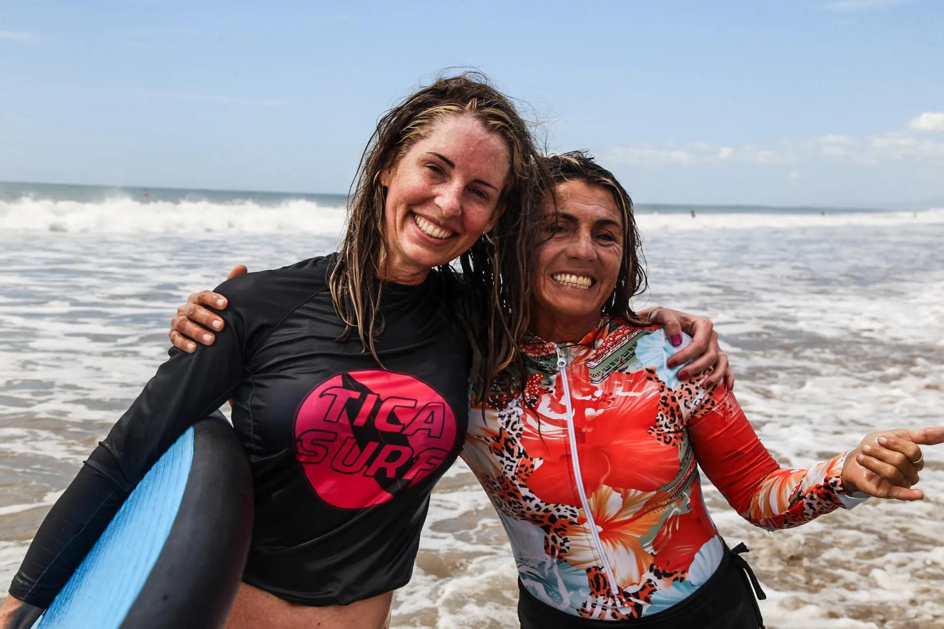 Student and surf instructor celebrating progress in the ocean at Santa Teresa Costa Rica